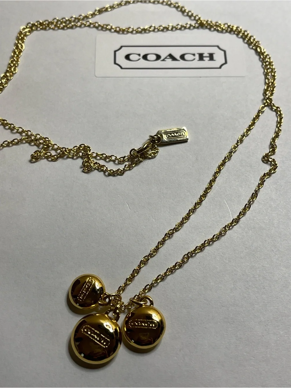 Coach Gold Pendant Necklace with Triple Medallion Reversible Charms